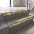Square edge with ramped back aluminium stair nosing, 70mm tread, everest (light grey) exterior grip insert, mirrorflect gold finish