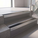 Square edge with ramped back aluminium stair nosing, 70mm tread, obsidian (dark charcoal) Mor Grip insert, mill finish finish