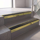 Square edge with ramped back aluminium stair nosing, 70mm tread, obsidian (dark charcoal) Mor Grip insert, mirrorflect gold finish