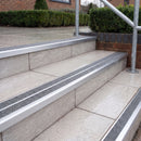Ramp back twin channel aluminium stair nosing 93 x 38mm in Mill Finish with two Everest gritted Exterior Grip inserts, fitted on wet outdoor entrance steps