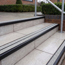 Ramp back twin channel aluminium stair nosing 93 x 38mm in Satin Black with two Everest gritted Exterior Grip inserts, fitted on wet outdoor entrance steps
