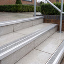 Ramp back twin channel aluminium stair nosing 93 x 38mm in Satin Silver with two Everest gritted Exterior Grip inserts, fitted on wet outdoor entrance steps