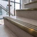 Antique brass ramped stair nosing with chalk carborundum insert fitted to concrete steps