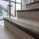 Antique bronze ramped stair nosing with chalk carborundum insert fitted to concrete steps