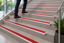 Red anti-slip insert on a semi-rounded bullnose stair nosing
