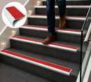 Carpet stair nosing with red anti-slip rubber insert