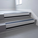 Regency Castellated insert in a 66x55mm square front aluminium stair nosing with 13mm black riser highlight, fitted to interior steps