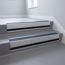 Regency Castellated insert in a cut to size 66x55mm aluminium stair nosing with 13mm black riser highlight, fitted to interior steps