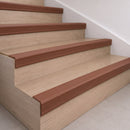 Brown 70x40mm rubber stair nosing fitted along the front edge of every oak veneer step in a home staircase