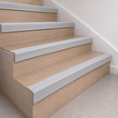 Grey 70x40mm rubber stair nosing fitted along the front edge of every oak veneer step in a home staircase