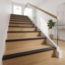 Black anodised aluminium ribbed stair nosing edge trim 40x20mm fitted to oak stair treads in a modern home hallway