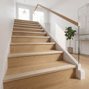 Champagne anodised aluminium ribbed stair nosing edge trim 40x20mm fitted to oak stair treads in a modern home hallway