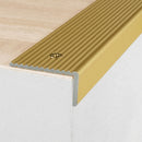 Gold anodised aluminium ribbed stair nosing edge trim 40x20mm on a wooden step edge