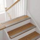 Inox stainless-steel-effect anodised aluminium ribbed stair nosing edge trim 40x20mm fitted to oak stair treads at a first-floor landing