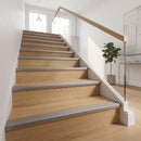 Inox stainless-steel-effect anodised aluminium ribbed stair nosing edge trim 40x20mm fitted to oak stair treads in a modern home hallway