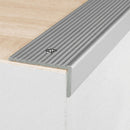 Silver anodised aluminium ribbed stair nosing edge trim 40x20mm screw-fixed to a wooden step edge