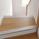 Silver anodised aluminium ribbed stair nosing edge trim 40x20mm fitted to oak stair treads at a first-floor landing
