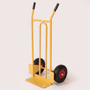 Yellow steel 200kg heavy duty sack truck with twin grip handles and black pneumatic wheels on red hubs, on a plain studio background