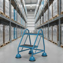 Blue mobile safety steps with twin handrail in a warehouse aisle