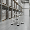 Grey mobile safety steps with twin handrail positioned in a warehouse aisle beside pallet racking