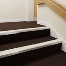Sand PVC insert fitted in aluminium stair nosings on a hotel staircase