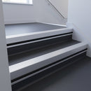 Satin Aluminium insert in a cut to size 66x55mm aluminium stair nosing with 13mm black riser highlight, fitted to interior steps