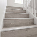 Silver anodised LVT stair nosing 42x28mm fitted on grey oak vinyl stairs, treads and risers clad
