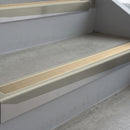 Mirroflect Silver deep-riser square-edge aluminium stair nosing fitted along two bare concrete steps, 62mm tread plate and 56mm front face, with a Beige anti-slip insert running the full width of each step
