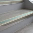 Mirroflect Silver deep-riser square-edge aluminium stair nosing fitted along two bare concrete steps, 62mm tread plate and 56mm front face, with a Sage Green anti-slip insert running the full width of each step