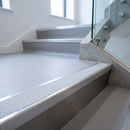 Mill finish aluminium stair nosing with everest insert on light grey vinyl treads in an office staircase