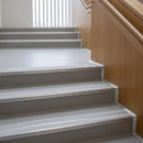 Mill finish double channel aluminium stair nosings with twin everest anti-slip inserts on grey linoleum library stair treads