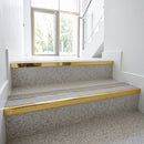 Mirrorflect gold double channel stair nosings with twin everest anti-slip inserts on light terrazzo apartment lobby stair treads