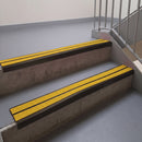 Square edge with ramped back aluminium stair nosing, 93mm tread, twin brimstone (safety yellow) exterior grip inserts, dark bronze finish