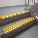 Square edge with ramped back aluminium stair nosing, 93mm tread, twin brimstone (safety yellow) exterior grip inserts, mill finish finish