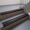 Square edge with ramped back aluminium stair nosing, 93mm tread, twin coal (black) exterior grip inserts, dark bronze finish