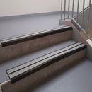 Square edge with ramped back aluminium stair nosing, 93mm tread, twin everest (light grey) exterior grip inserts, dark bronze finish