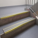 Square edge with ramped back aluminium stair nosing, 93mm tread, twin everest (light grey) exterior grip inserts, mirrorflect gold finish