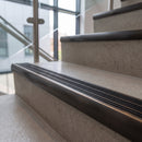 Antique Bronze finish - solid brass ramped stair nosing 83x40mm with black carborundum grit inserts fitted on concrete steps