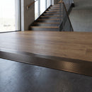 Solid Brass Stair Nosing 30mm Tread Ramp Feather Edge Profile in antique bronze finish fitted on a step edge