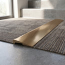 Solid Brass Stair Nosing 30mm Tread Ramp Feather Edge Profile in polished brass finish fitted on a step edge
