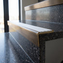 Solid Brass Stair Nosing 59.5mm Raked Back Slimline Profile in antique bronze finish fitted on a step edge
