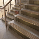 Antique Brass finish with Fawn Castellated insert - 59.5mm solid brass raked front single channel stair nosing fitted to a stone step