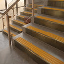 Antique Brass finish with Gold Castellated insert - 59.5mm solid brass raked front single channel stair nosing fitted to a stone step
