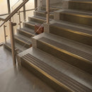 Antique Brass finish with Granite Castellated insert - 59.5mm solid brass raked front single channel stair nosing fitted to a stone step