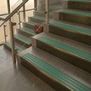 Antique Brass finish with Jade Castellated insert - 59.5mm solid brass raked front single channel stair nosing fitted to a stone step