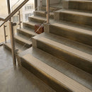 Antique Brass finish with Porth Stone Castellated insert - 59.5mm solid brass raked front single channel stair nosing fitted to a stone step