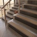 Antique Bronze finish with Fawn Castellated insert - 59.5mm solid brass raked front single channel stair nosing fitted to a stone step