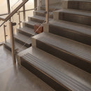 Antique Bronze finish with Flint Castellated insert - 59.5mm solid brass raked front single channel stair nosing fitted to a stone step