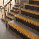 Antique Bronze finish with Gold Castellated insert - 59.5mm solid brass raked front single channel stair nosing fitted to a stone step