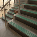 Antique Bronze finish with Jade Castellated insert - 59.5mm solid brass raked front single channel stair nosing fitted to a stone step